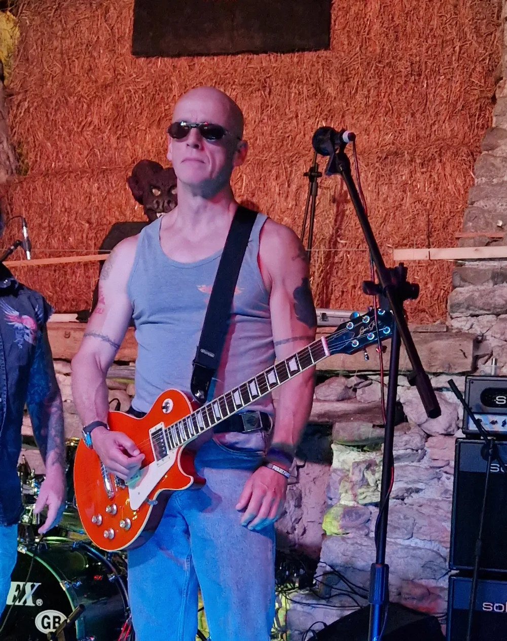 Jon Montgomerie playing guitar with Electric Outlawz